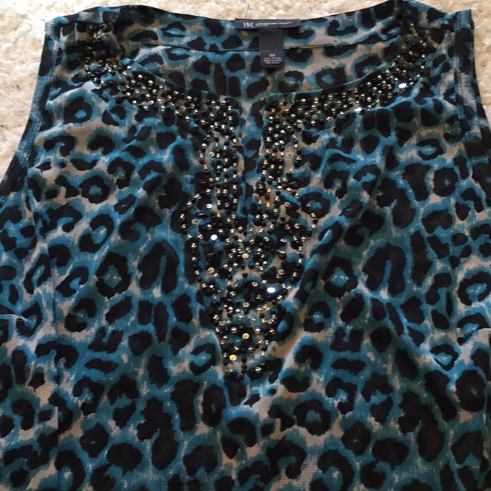 Dress up or down Inc sleeveless top.